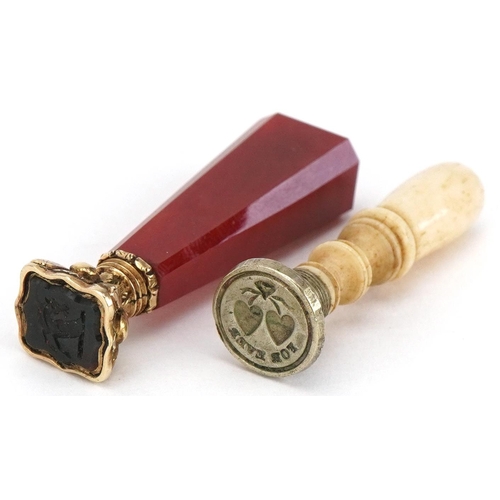 75 - Victorian silver gilt and bloodstone seal, 4.5cm high, together with a 19th century turned bone seal... 