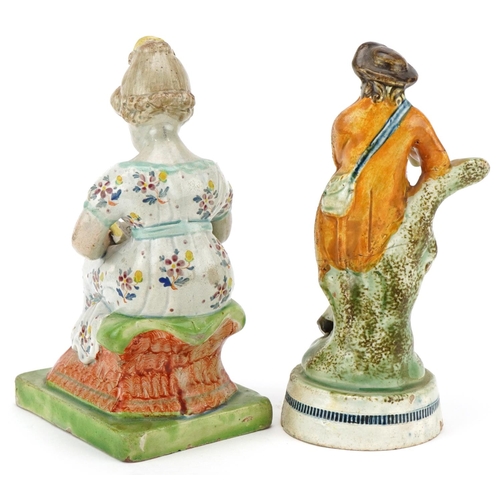 315 - Two 18th century Staffordshire Prattware figures, one modelled as a man playing a horn, the other a ... 