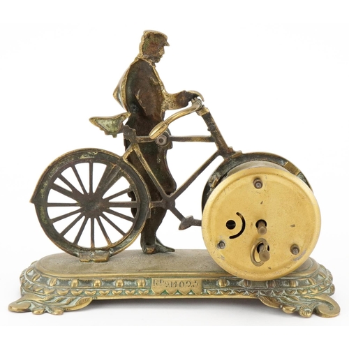 235 - Early 20th century brass desk timepiece modelled as a man with a bicycle, 16cm H x 19cm W x 9cm D