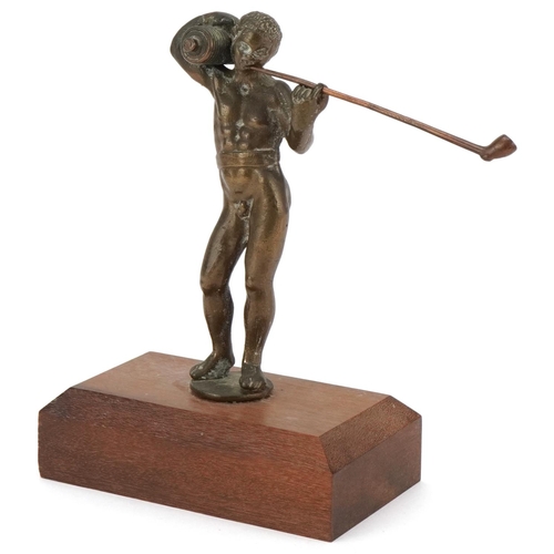 78 - Late 19th century bronze figure of a naked man smoking a pipe mounted on a later wooden base, overal... 