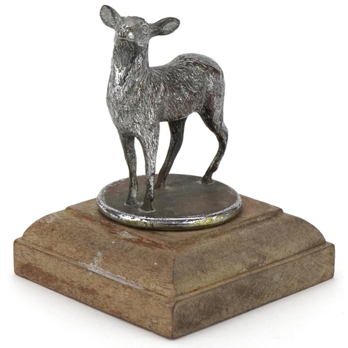 2456 - Early to mid 20th century cast metal car mascot in the form of a goat, mounted on a later wooden bas... 