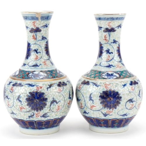 213 - Pair of Chinese porcelain enamelled pear shaped vases, Kangxi marks but probably later, each bearing... 