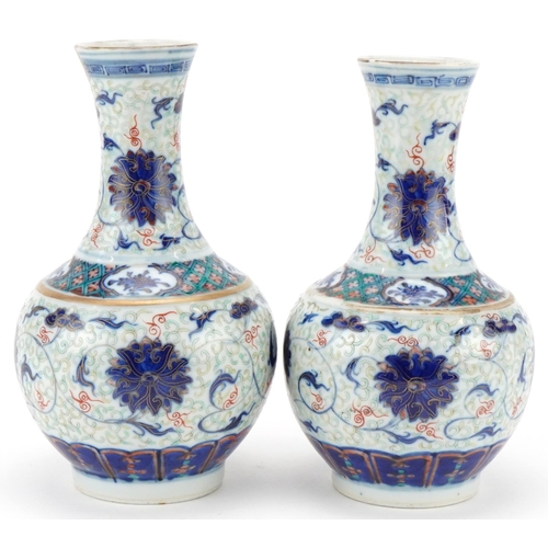 213 - Pair of Chinese porcelain enamelled pear shaped vases, Kangxi marks but probably later, each bearing... 