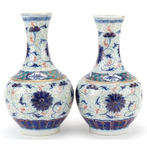 213 - Pair of Chinese porcelain enamelled pear shaped vases, Kangxi marks but probably later, each bearing... 