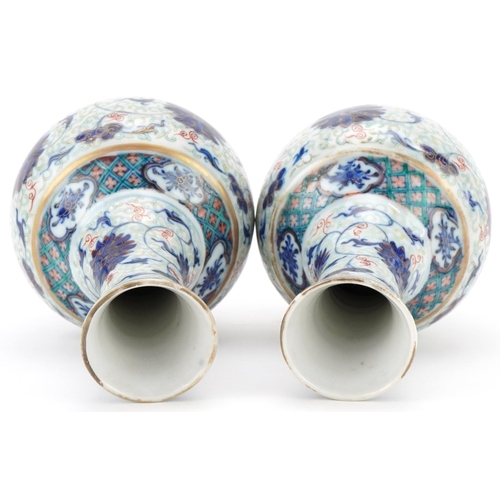 213 - Pair of Chinese porcelain enamelled pear shaped vases, Kangxi marks but probably later, each bearing... 