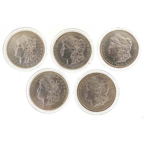 2167 - Five American silver Morgan dollars encased in plastic