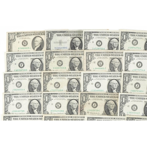 2234 - Thirty American one dollar notes, ten dollar note and four silver American coins including Morgan do... 