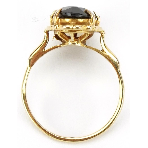 3295 - 9ct gold garnet ring, the garnet 14.95mm x 7.15mm, size J, 2.5g