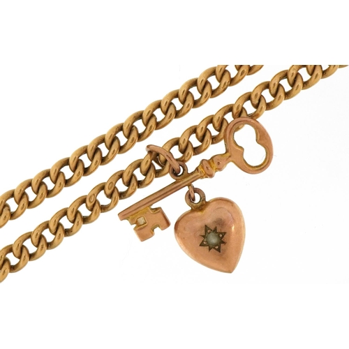 3206 - Unmarked gold watch chain design necklace with a 9ct rose gold key and love heart pendant set with a... 