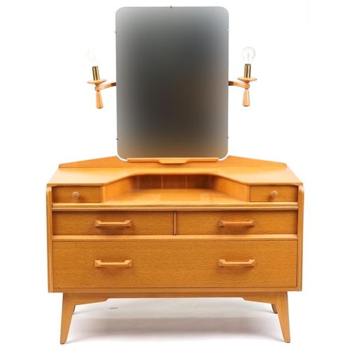 1004 - Mid 20th century G Plan golden oak bedroom suite comprising dressing table, chest of drawers, bedsid... 