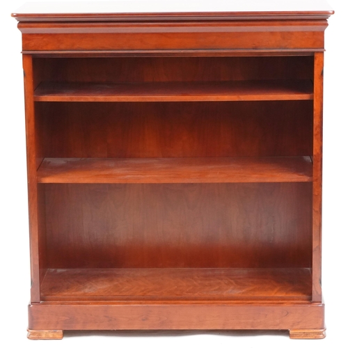 1063 - Modern mahogany open bookcase by St. Michael Furniture fitted with adjustable shelves, 103cm H x 90c... 