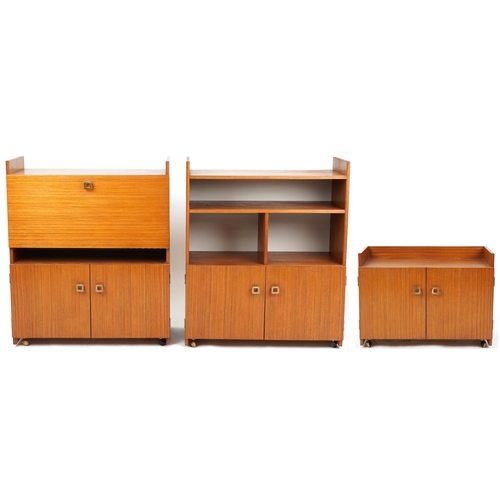 1060 - Three late 20th century teak veneered shelving units, the largest two units 98cm H x 82cm W x 38cm D