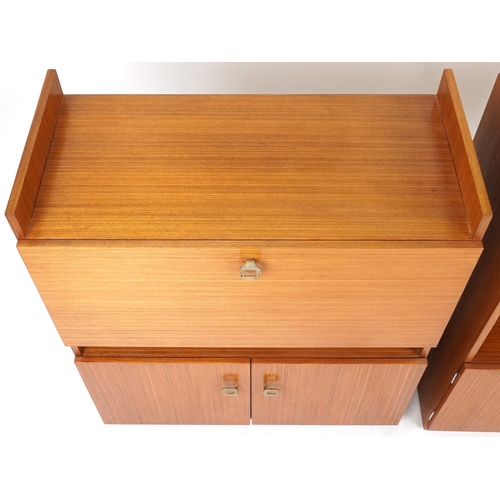 1060 - Three late 20th century teak veneered shelving units, the largest two units 98cm H x 82cm W x 38cm D