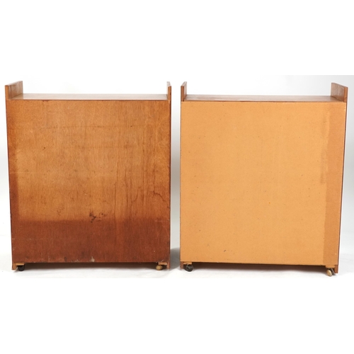 1060 - Three late 20th century teak veneered shelving units, the largest two units 98cm H x 82cm W x 38cm D