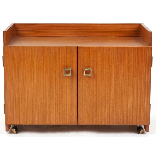 1060 - Three late 20th century teak veneered shelving units, the largest two units 98cm H x 82cm W x 38cm D