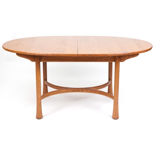 1112 - Ercol elm extending dining table raised on turned legs united by bentwood stretchers, 73cm H x 164cm... 