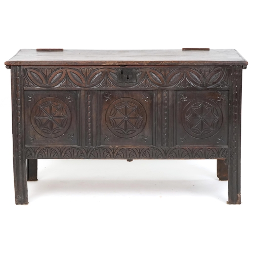 1014 - 18th century oak coffer with later carved decoration, the hinged lid raised on stile supports, 78cm ... 