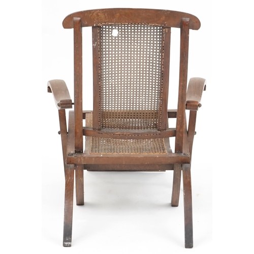 1094 - Early 20th century beech framed folding steamer chair with cane seat and back, 90cm H x 63cm W x 120... 