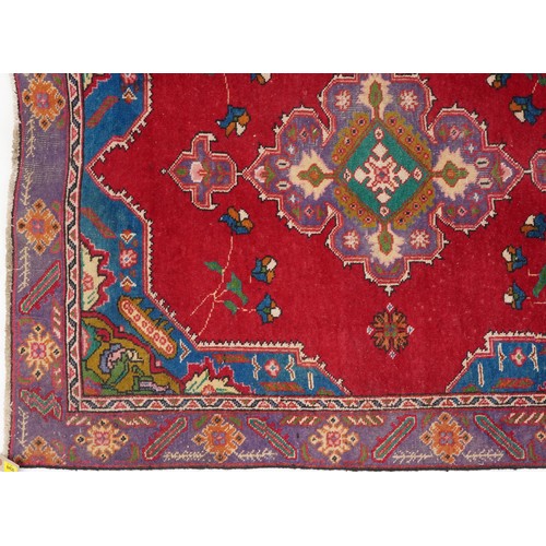 1019 - Ghashghai rug, South West Persia, mid 20th century, the red field with a central pink medallion supp... 