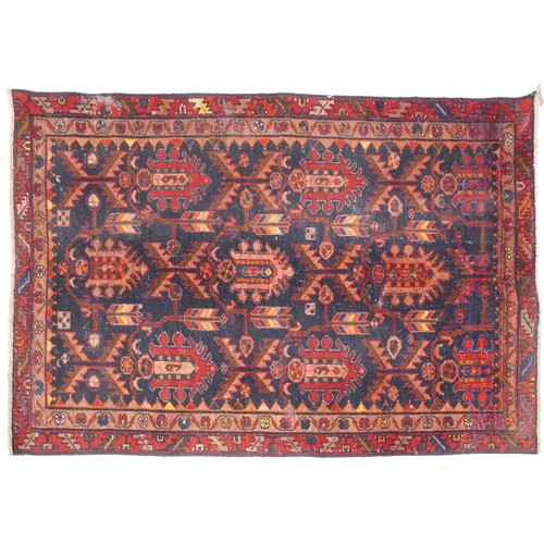 1018 - Hamadan rug, North West Persia, early 20th century, the dark blue field with three rows of shaped me... 