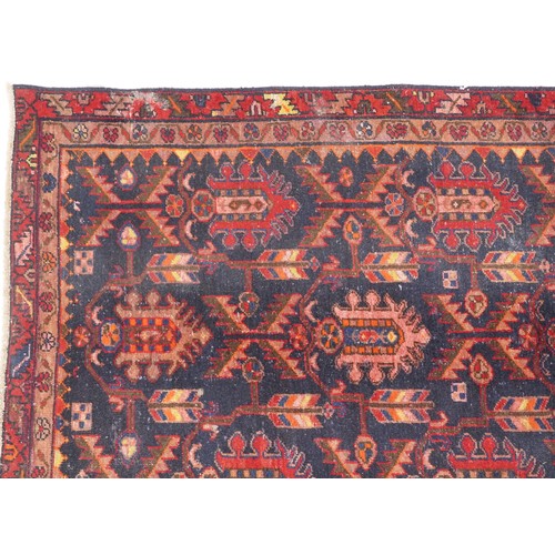 1018 - Hamadan rug, North West Persia, early 20th century, the dark blue field with three rows of shaped me... 