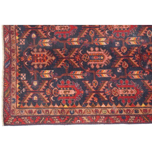 1018 - Hamadan rug, North West Persia, early 20th century, the dark blue field with three rows of shaped me... 