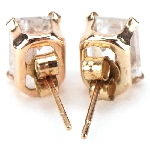 3327 - Pair of 9ct gold clear stone stud earrings, each 7mm high, total 1.1g