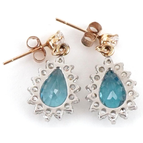 3274 - Pair of yellow metal blue topaz and clear stone teardrop earrings, each 1.8cm high, total 2.0g