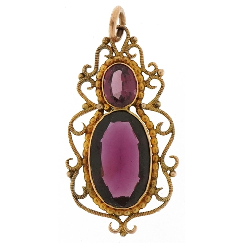 3192 - Edwardian unmarked gold garnet openwork pendant, 3.5cm high, 3.0g