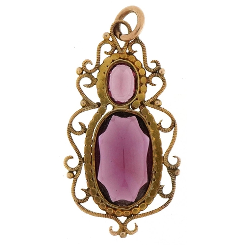 3192 - Edwardian unmarked gold garnet openwork pendant, 3.5cm high, 3.0g