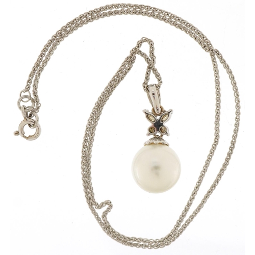 3246 - Unmarked white gold cultured pearl and diamond pendant on a 9ct white gold necklace, 2.5cm high and ... 