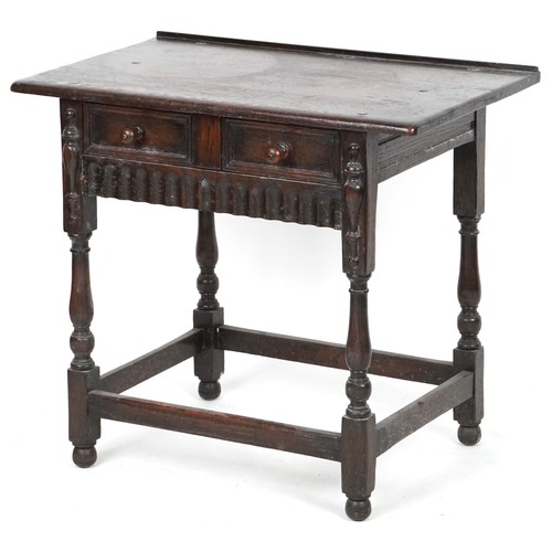 1013 - Jacobean Revival oak side table fitted with a single frieze drawer raised on turned and block legs, ... 