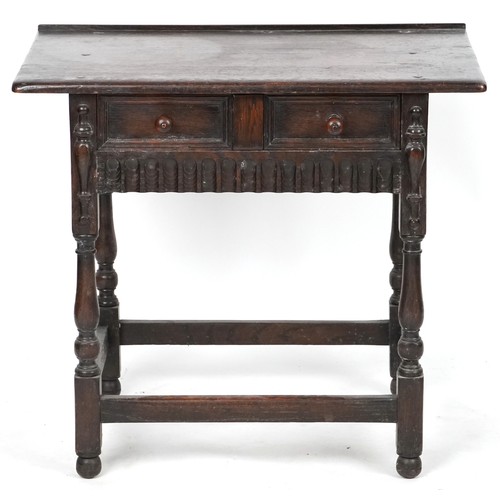 1013 - Jacobean Revival oak side table fitted with a single frieze drawer raised on turned and block legs, ... 