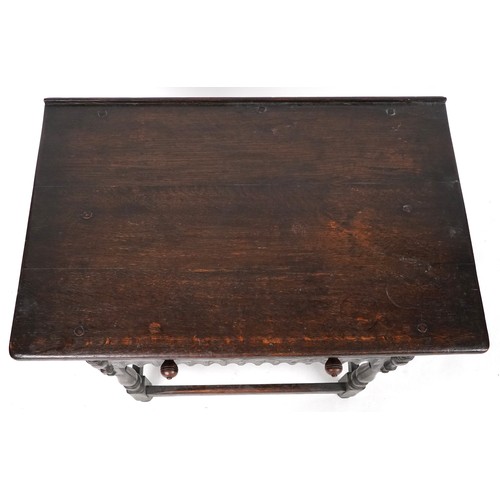 1013 - Jacobean Revival oak side table fitted with a single frieze drawer raised on turned and block legs, ... 