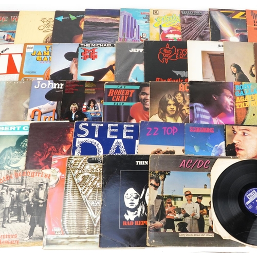 654 - Vinyl LP records including Fleetwood Mac, Thin Lizzy, AC/DC, John Winter, Scorpions,  Santana, Saxon... 