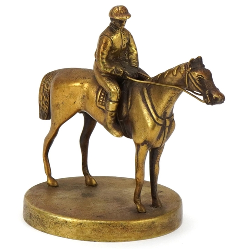 2457 - Early 20th century polished brass car mascot in the form of a jockey and racing horse, 11cm high