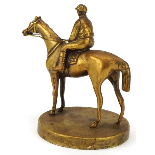 2457 - Early 20th century polished brass car mascot in the form of a jockey and racing horse, 11cm high