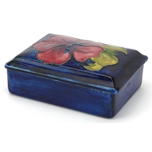 25 - William Moorcroft Orchid pattern pottery box and cover with paper label to the interior and exterior... 