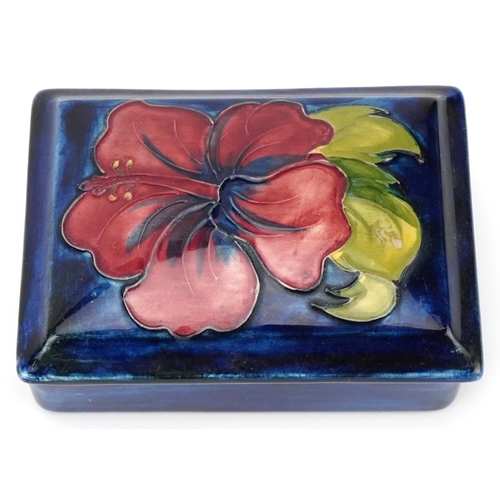 25 - William Moorcroft Orchid pattern pottery box and cover with paper label to the interior and exterior... 