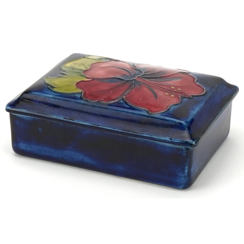 25 - William Moorcroft Orchid pattern pottery box and cover with paper label to the interior and exterior... 