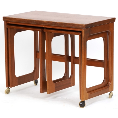 1073 - Nest of three mid 20th century teak occasional tables, H-59cm W-74cm D-41cm