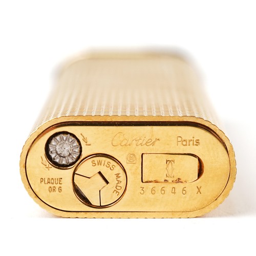 170 - Must de Cartier, gold plated engine turned pocket lighter with box and certificate, 7cm high