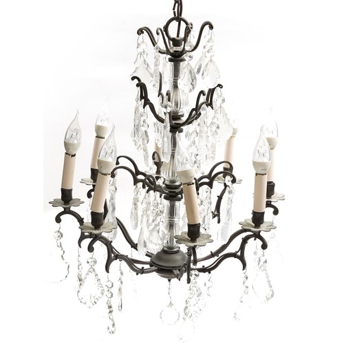 1111 - Bronzed metal eight branch chandelier with cut glass drops, 65cm high x 50cm in diameter