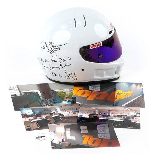 The Stig BBC Top Gear autographed motor racing helmet signed by the Stig and Jeremy Clarkson. This controversial helmet believed to be the the one signed for the Irish producer Oisin Tymon whom Clarkson had an altercation with in 2015, signed by Clarkson -F..k Off and The Stig - To the Main Man Osh!! Stay Speedy Brother along with James May, PROVENANCE: Left in the offices of Top Gear when the studio was abandoned after the altercation and then the axing of the show