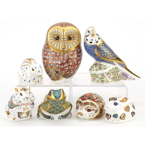 1173 - Seven Royal Crown Derby animal paperweights with stoppers comprising Violet Budgerigar, Owl, New Yea... 