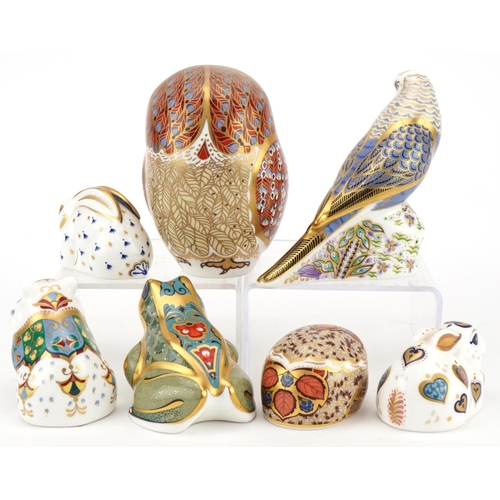 1173 - Seven Royal Crown Derby animal paperweights with stoppers comprising Violet Budgerigar, Owl, New Yea... 