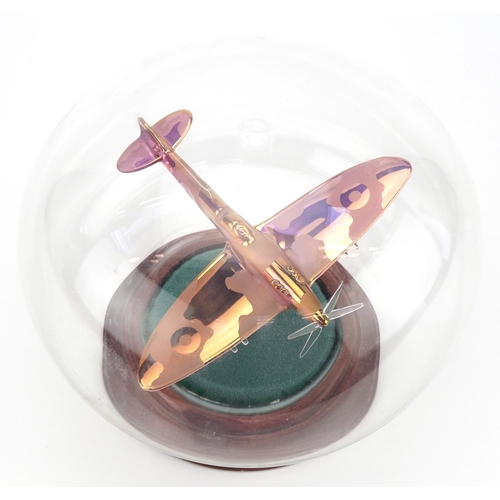 1361 - A Northumbrian glass study of a Spitfire in a glass dome, 20cm in diameter.