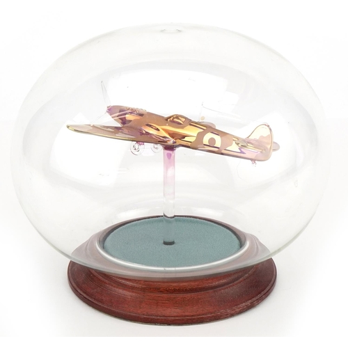 1361 - A Northumbrian glass study of a Spitfire in a glass dome, 20cm in diameter.