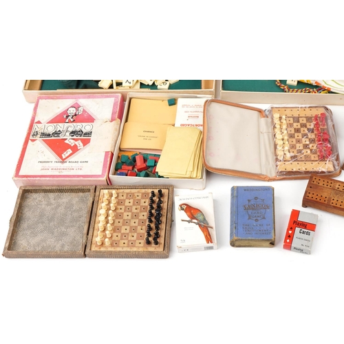 1290 - Vintage and later toys including Monopoly, Scrabble, bone and ebony Dominoes and travel chess sets.