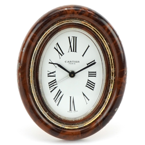  A Cartier enamelled strut clock with tooled leather Cartier box, numbered 7509 11534, 9cm high.